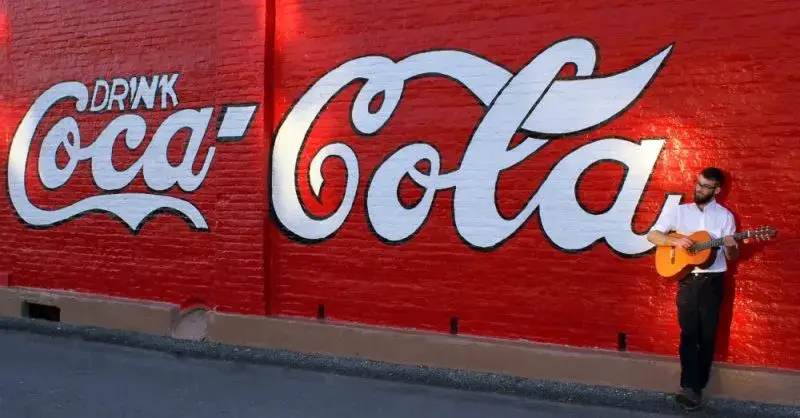 1894 Coca-Cola wall sign in downtown Cartersville, a landmark near Scott’s Walk-Up Bar-B-Q