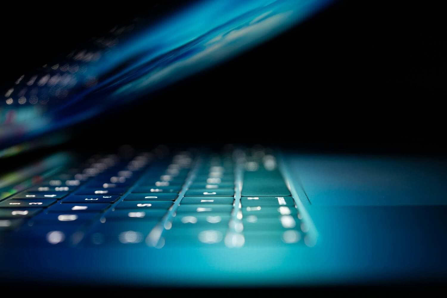 Glowing laptop representing digital web solutions
