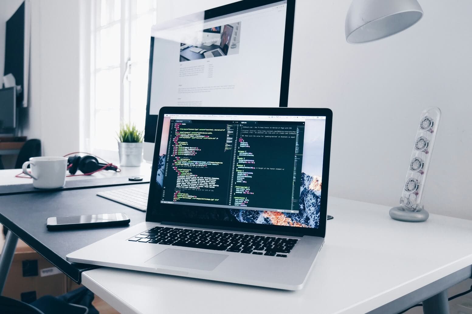 Laptop on desk, white background